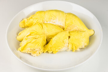 Durian mon thong is king of fruits durian and durian peeled fruit plate tropical durian on white background healthy durian fruit food isolated