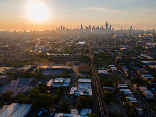 4k aerial drone footage of Chicago skyline during sunrise early morning with light fog rolling...