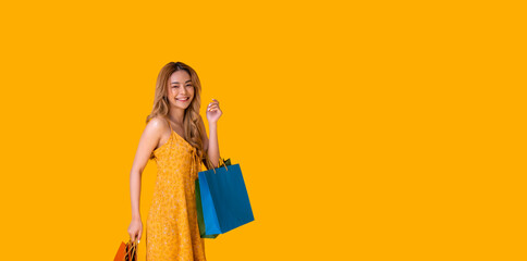 Cute Asian girl shopping for sale.She bought a lot of products from the discounted price.