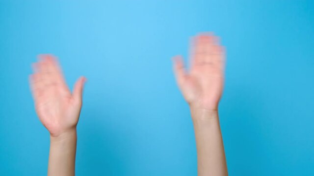 Hi gesture. Close up of unrecognizable young woman waving hands showing hello, isolated on blue studio background with copy space for advertisement. Greeting sign.