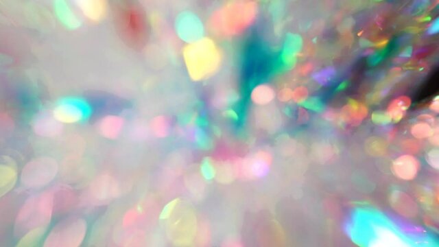 Soft pastel neon pink blue purple silver crystal lights bokeh. Luxury background. Blurred holographic holiday lights. Posterized Abstract Effect