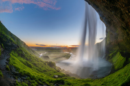 Beautiful and powerful of streaming at Seljalandsfoss waterfall from cave under waterfall in evening,Summer,Iceland. © Theerayoot