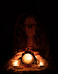 Mystical woman looking into crystal ball