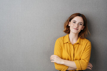 Pretty young woman grinning at the camera