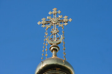 Fototapeta na wymiar A golden russian orthodox cross.