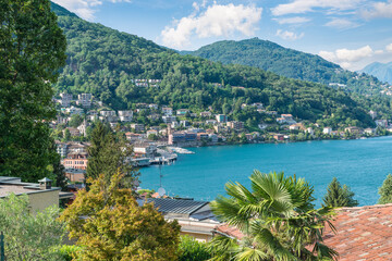 Big european lake. Lake Lugano with the customs bridge between Lavena Ponte Tresa in Italy and Ponte Tresa on the right in Switzerland. Border between Italy and Switzerland
