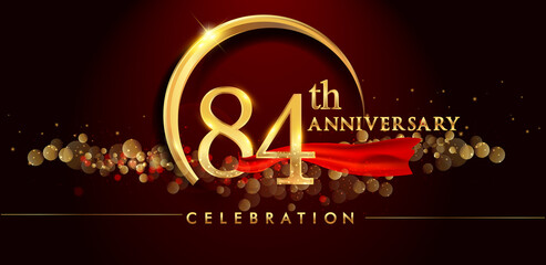 84th anniversary logo with golden ring, confetti and red ribbon isolated on elegant black background, sparkle, vector design for greeting card and invitation card