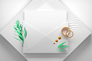 Opened paper envelope with blank card and plant branch with golden wedding engagement rings, plant branch and golden spheres