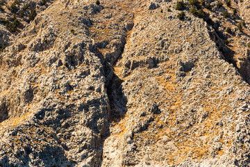 Rock formation showing layers of textured sedimentary rock