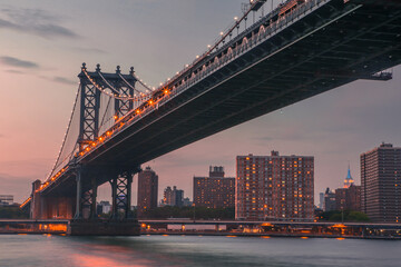Manhattan Bridge and City Skyline at sunset
