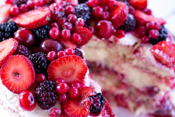 Sweet summer concept. Different berries and cut out cake price.