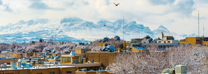 It's Panorama of Isfahan, Iran and the mountains. View from the Ali Qapu palace
