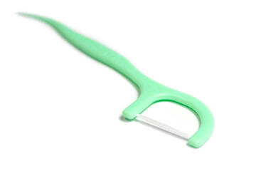 New toothpick and dental floss isolated on white background.
