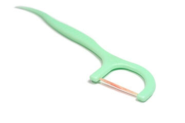 Toothpick and dental floss already used with blood form bleeding gums isolated on white background.