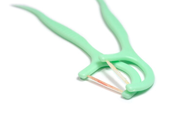 Toothpick and dental floss already used with blood form bleeding gums isolated on white background.