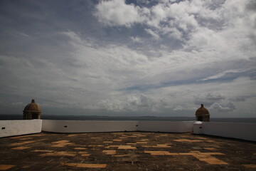 Naklejka na ściany i meble View of historic architecture of farol da barra with sea in Salvador Bahia, Brazil