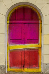 old door in bright colors pink yellow red