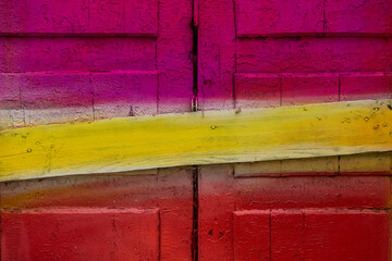 old door in bright colors pink yellow red