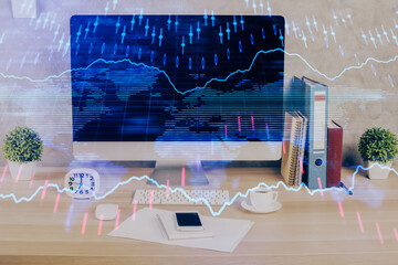 Forex graph hologram on table with computer background. Double exposure. Concept of financial markets.