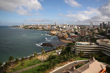 Fototapeta premium View of farol da barra and city skyline along Salvador beach in Salvador Bahia, Brazil