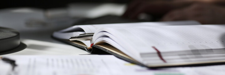 Financial statistics documents on clipboard pad at office table closeup. Internal Revenue Service inspector sum check, irs investigation, exchange market, earnings, savings, loan and credit concept