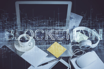 Multi exposure of blockchain and crypto economy theme hologram and table with computer background. Concept of bitcoin cryptocurrency.