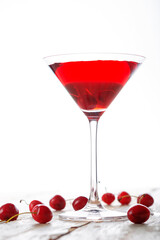 fresh red cherry juice in a wine glass with red cherries 