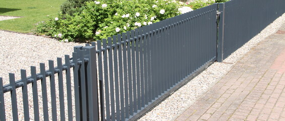 a new house with a metal sliding gate