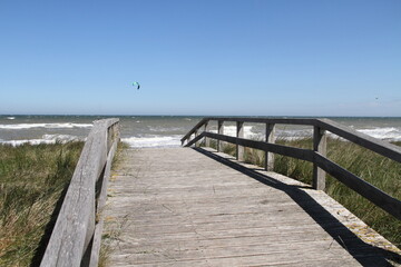 a wooden bridge as access to the beach on the Baltic Sea