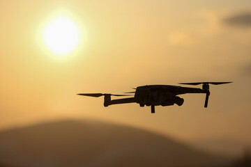 Fototapeta na wymiar The drone in the sunset sky.