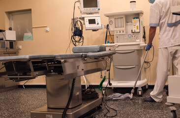 Cleaning staff cleaning the operating room