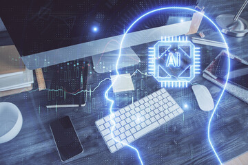 Double exposure of table with computer and brain hologram. Data innovation concept.