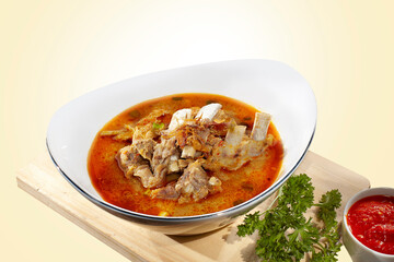 Beef Rib curry or coconut milk rib soup. Ribs cooked with coconut milk and Asian spices.