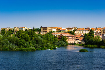 Fototapeta na wymiar It's Old City of Salamanca, UNESCO World Heritage. And river Tormes, Salamanca, Spain