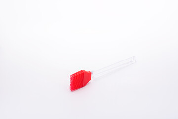 red silicone kitchen accessories on a white background.
