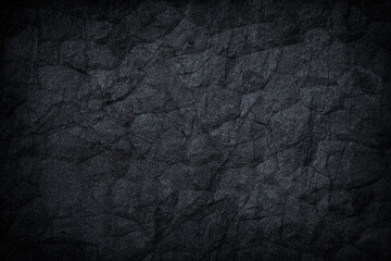 Dark grey black slate stone background or texture.