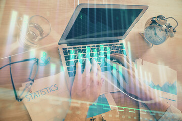 Multi exposure of forex graph with man working on computer on background. Concept of market analysis.