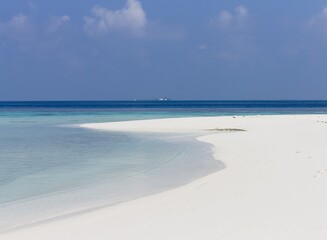 Fototapeta na wymiar A desert island with a white sand in the Indian ocean (Ari Atoll, Maldives, Asia)