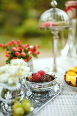 Table setting in a forest for a romantic wedding dinner