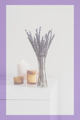 Toned framed image of dried lavender and aroma candles. Purple frame, faded color. Aromatherapy concept, space for text