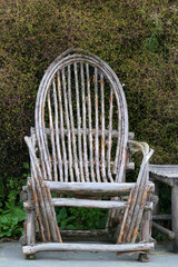 Antiquity: very old rotten wooden chair with backrest from bygone times
