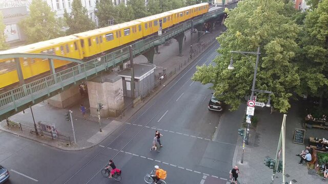 Berlin, Germany - June 19, 2020: The U-Bahn rapid transit railway passing above the Sch&ouml;nhauser Allee boulevard on an elevated railway in the Prenzlauer Berg district
