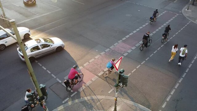 Berlin, Germany - June 19, 2020: Bikers crossing the road using the bicycle lane