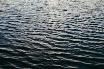 view of dark rippled lake water surface texture
