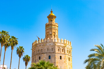 Fototapeta na wymiar It's Torre de Oro (Golden Tower), a dodecagonal military watchtower in Seville, Spain