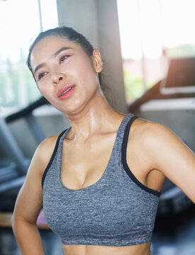 Portrait of a beautiful Asian woman with a sweaty face.