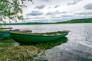 Boats on the shore of a picturesque lake.