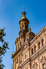 Fototapeta premium It's South tower of the Central building at the Plaza de Espana in Seville, Andalusia, Spain. It's example of the Renaissance Revival style in Spanish architecture.