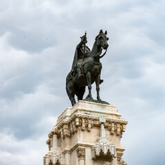Fototapeta na wymiar It's Bronze equestrian statue of Ferdinand III of Castile in the Plaza Nueva, Sevilla