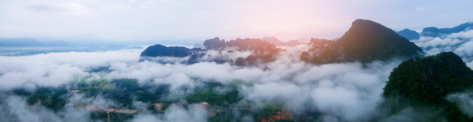 panorama misty landscape that floats over the mountains and the morning sun.